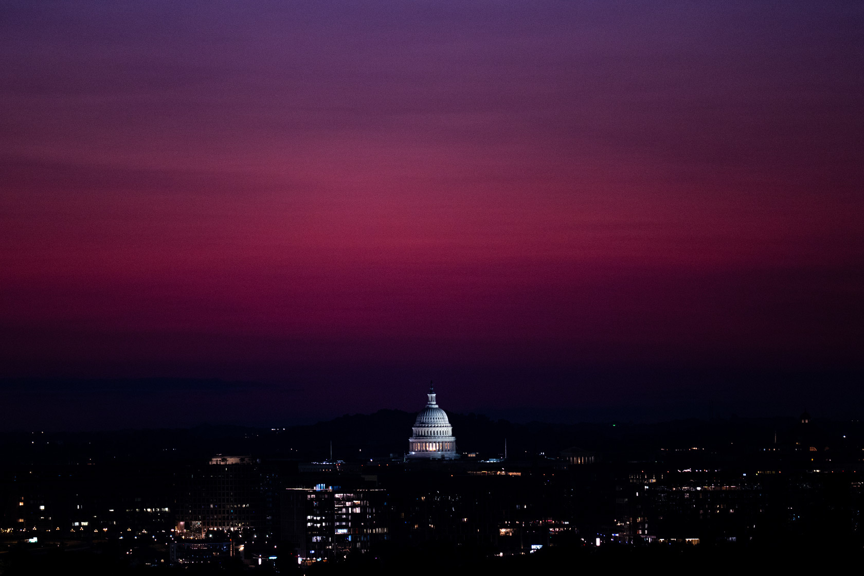 The U.S. Capitol dome is seen before sunrise, July 2024.